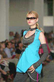 Photograph of models wearing designs by Kingston University fashion students