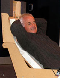 Inventor Dominic Robinson demonstrates his aircraft seat