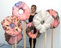 Student Sophie Taylor looks at work by fellow student John Brown entitled â€˜You will never gain weight from a doughnut holeâ€™