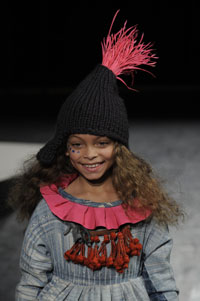 A model wears an outfit designed by childrenswear designer Laura Harvey.