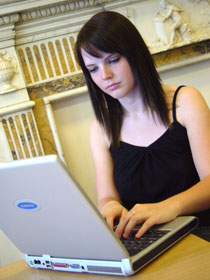 Photo of student using a laptop computer.