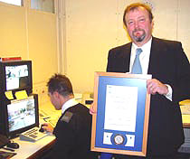 Photo of KUSCO security manager Tony Patten with award.