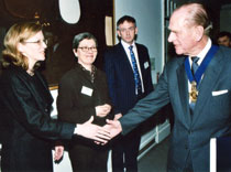 Photo of Anne Chick, left, meeting Prince Philip. 
