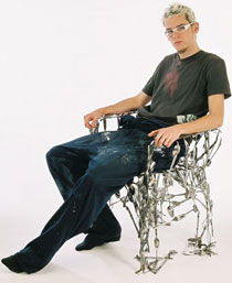 Photo of Osian Batyka-Williams with his cutlery chair.