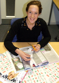 Hannah Smith from Kingston Universityâ€™s Sustainability Team demonstrates how to use second-life packaging to wrap Christmas gifts. 